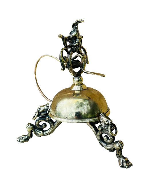 Antique French bronze table bell featuring a detailed mascaron design. Exquisite craftsmanship and vintage charm, perfect for adding a unique touch to your home decor.