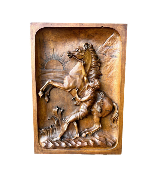 Hand-carved antique panel in solid walnut wood, depicting a prancing horse subdued by a groom, inspired by Guillaume Coustou's famous Chevaux de Marly, late XIXᵉ century. Handcrafted wall sculpture, ideal for an equestrian decoration or French art collection.