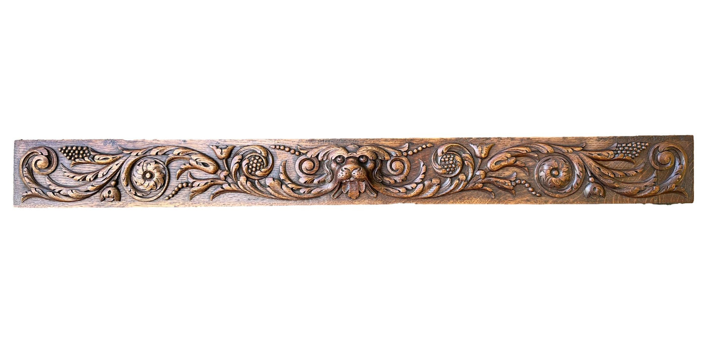 Large antique French pediment in hand-carved wood withdog and floral motif