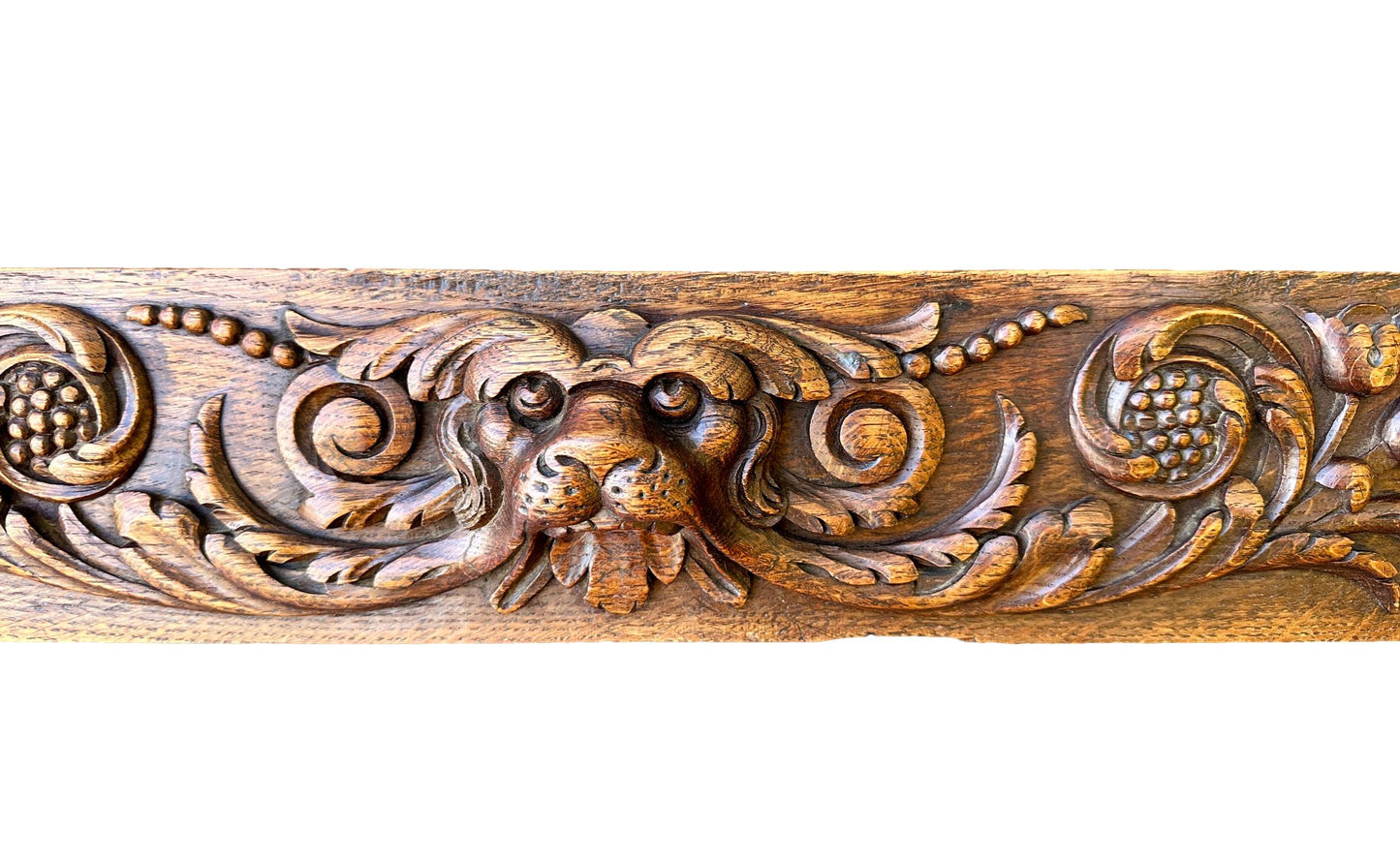 Large antique French pediment in hand-carved wood withdog and floral motif