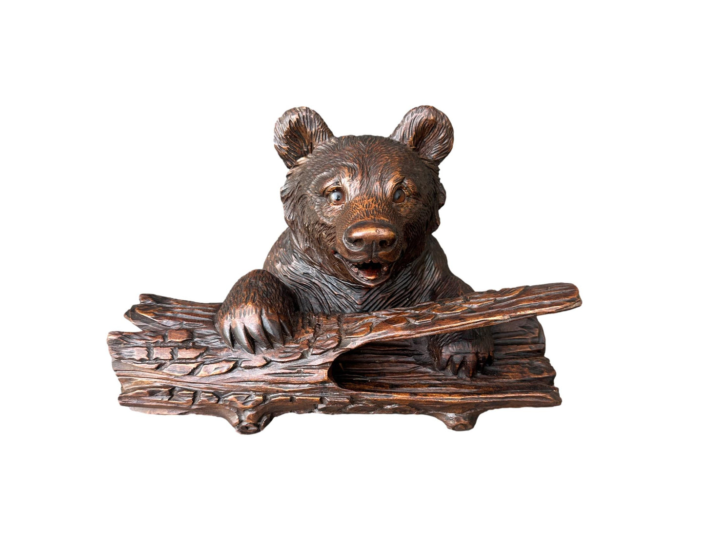 Antique Black Forest inkwell featuring a hand-carved bear holding an ink pot