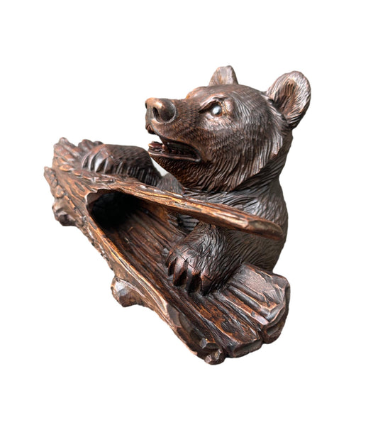 Antique Black Forest inkwell featuring a hand-carved bear holding an ink pot