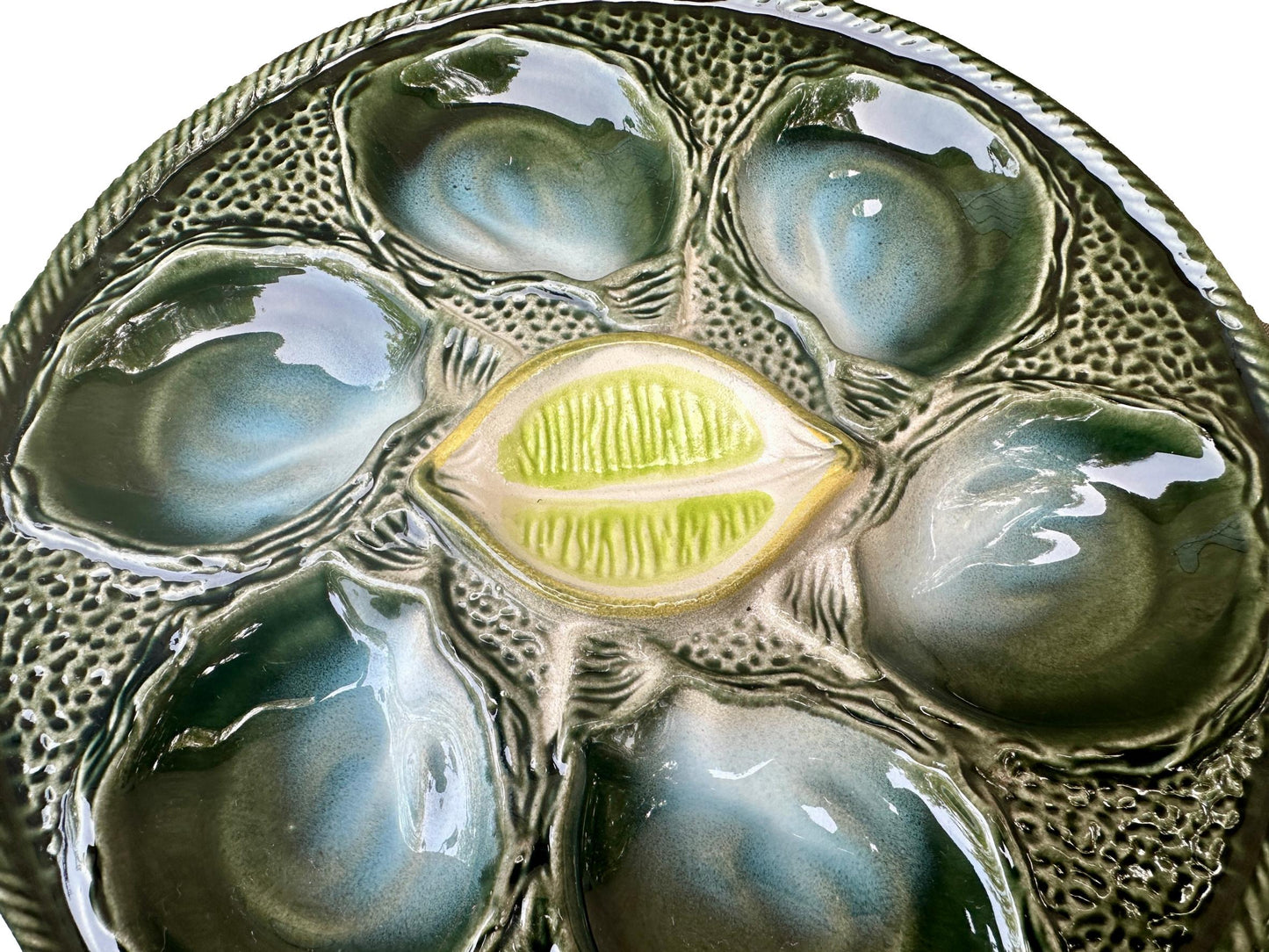 Vintage French Majolica oyster plate by Saint Clément, circa 1930, with six green-blue shell wells and a central lemon design, glazed ceramic faience, Art Deco coastal decor.