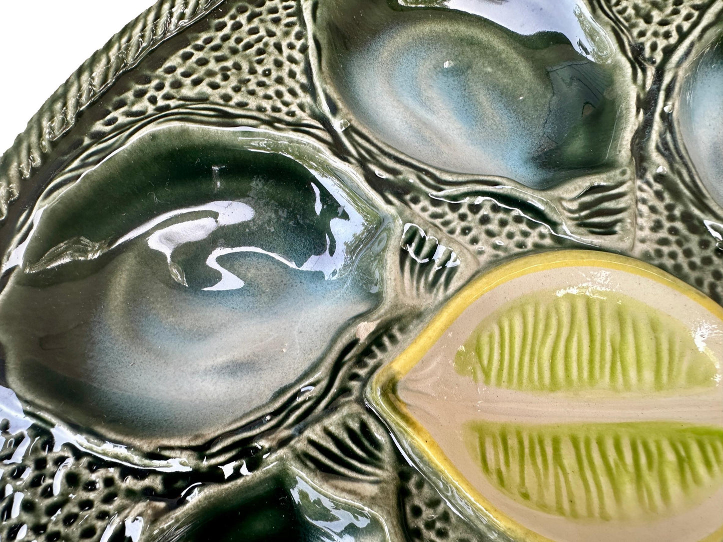 Vintage French Majolica oyster plate by Saint Clément, circa 1930, with six green-blue shell wells and a central lemon design, glazed ceramic faience, Art Deco coastal decor.