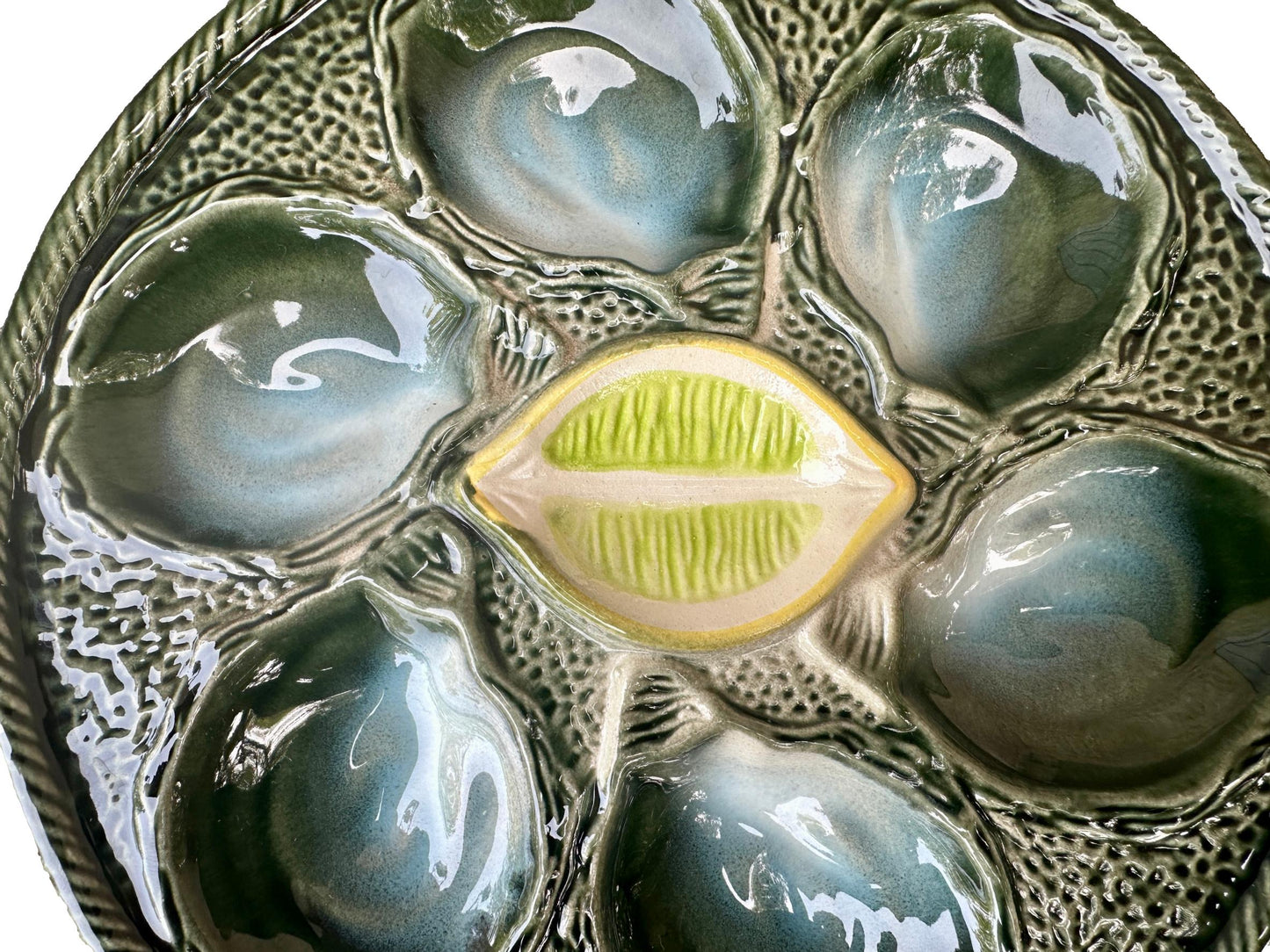 Vintage French Majolica oyster plate by Saint Clément, circa 1930, with six green-blue shell wells and a central lemon design, glazed ceramic faience, Art Deco coastal decor.