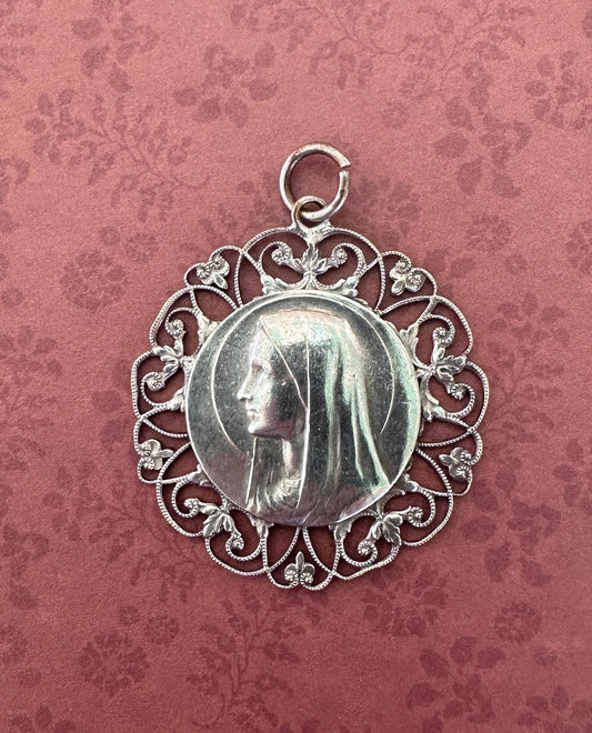 Large silver-plated pendant featuring an openwork design of the Virgin Mary. A stunning religious jewelry piece, perfect for spiritual expression or as a meaningful gift