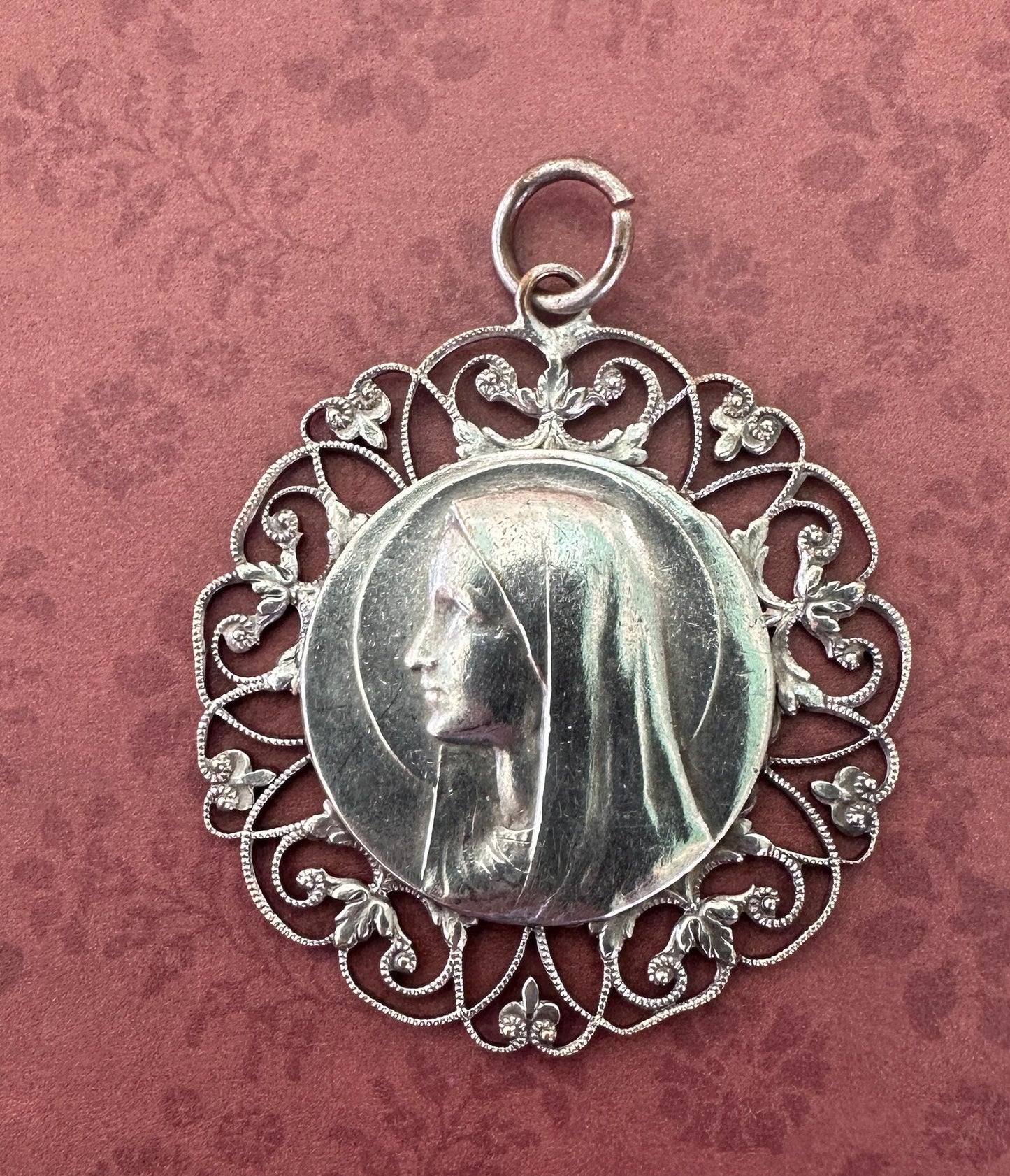 Large silver-plated pendant featuring an openwork design of the Virgin Mary. A stunning religious jewelry piece, perfect for spiritual expression or as a meaningful gift