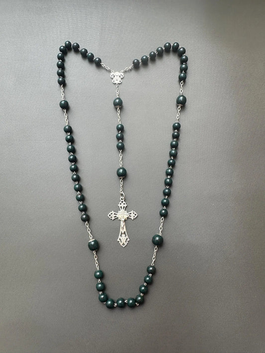 Antique bloodstone rosary with sterling silver crucifix on white background