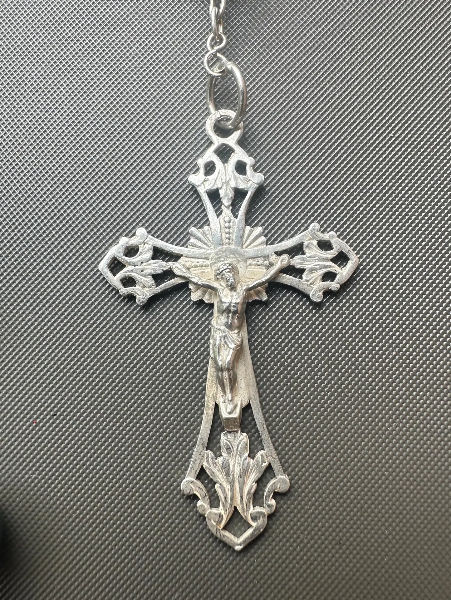 Antique bloodstone rosary with sterling silver crucifix on white background