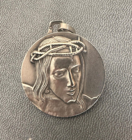 Solid silver medal with high-relief Christ crowned with thorns, Minerva hallmark, Cunfraterna di Santa Croce Bastia inscription.