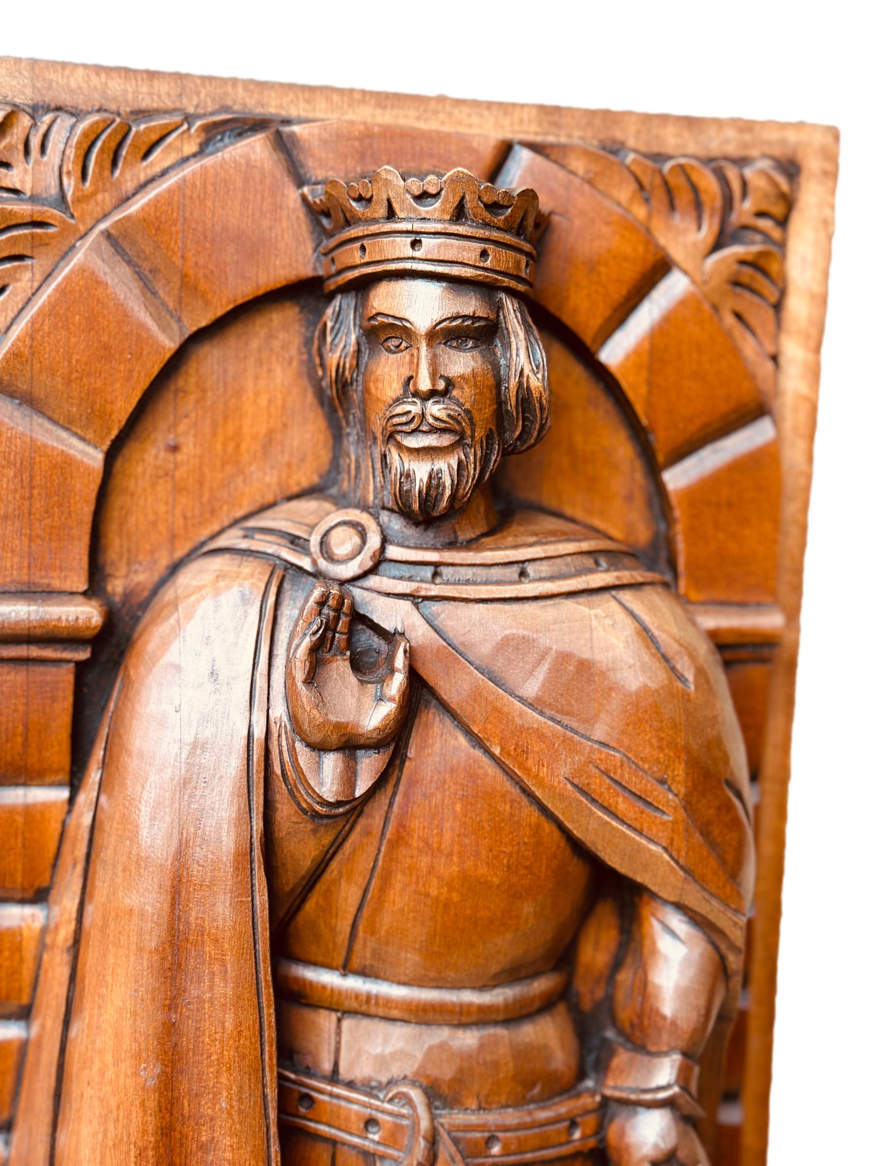 Exquisite French antique hand-carved wooden panel featuring a crowned king in Gothic style, showcasing intricate craftsmanship.