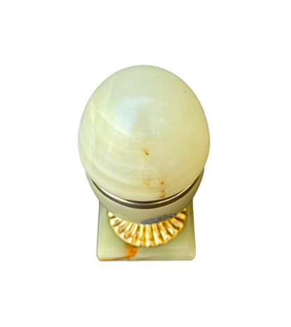 Vintage onyx egg-shaped jewelry box with gold-toned base and white-yellow stone, 1970s design