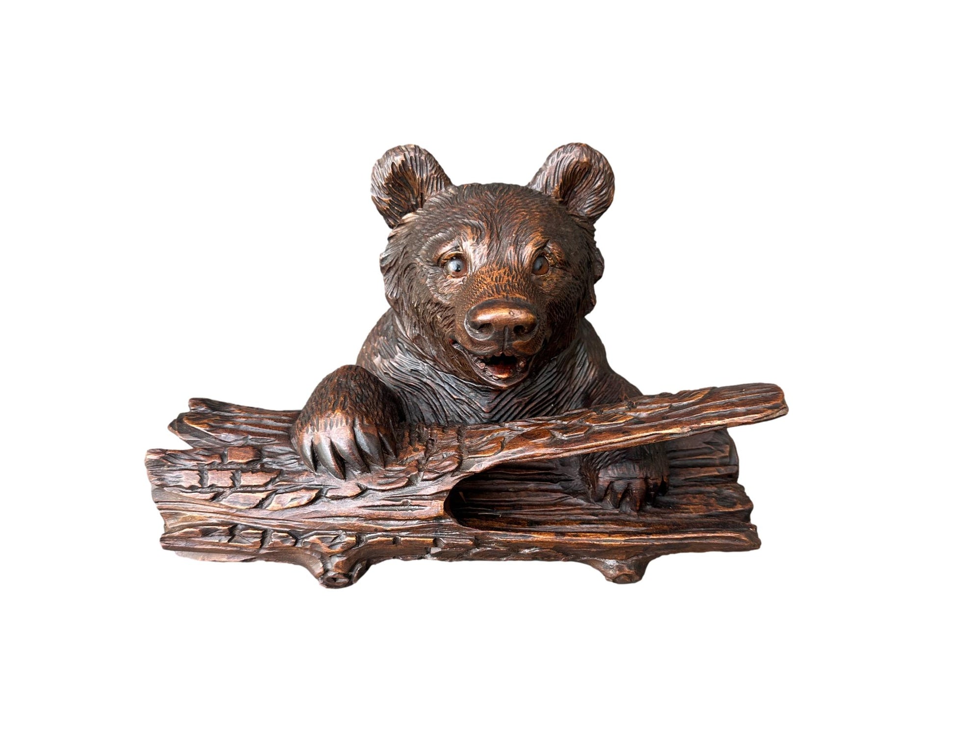Antique Black Forest inkwell featuring a hand-carved bear holding an ink pot