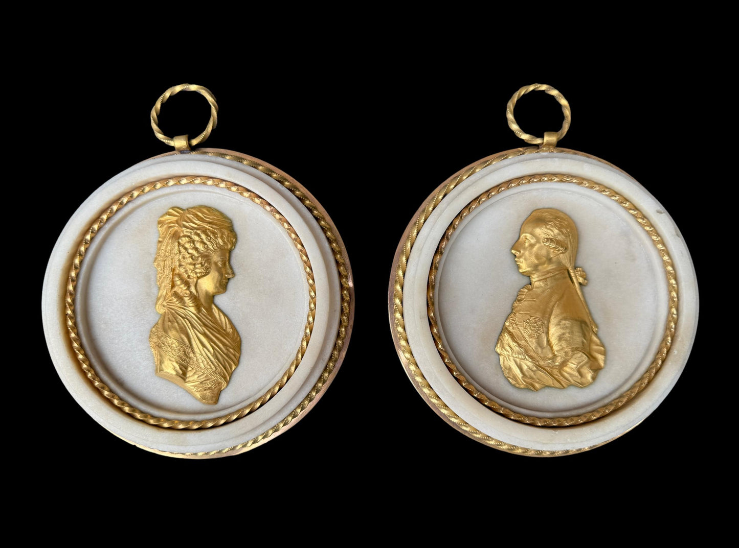 Pair of Louis XVI gilt bronze and marble portrait medallions, depicting Franz I and Maria Theresa, circa 1792