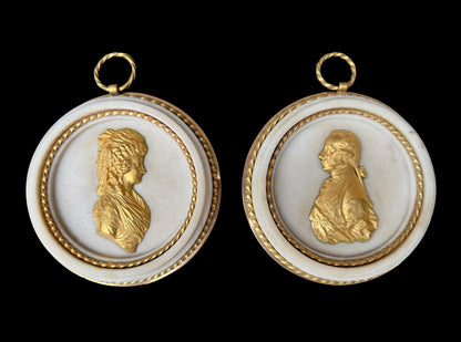 Pair of Louis XVI gilt bronze and marble portrait medallions, depicting Franz I and Maria Theresa, circa 1792