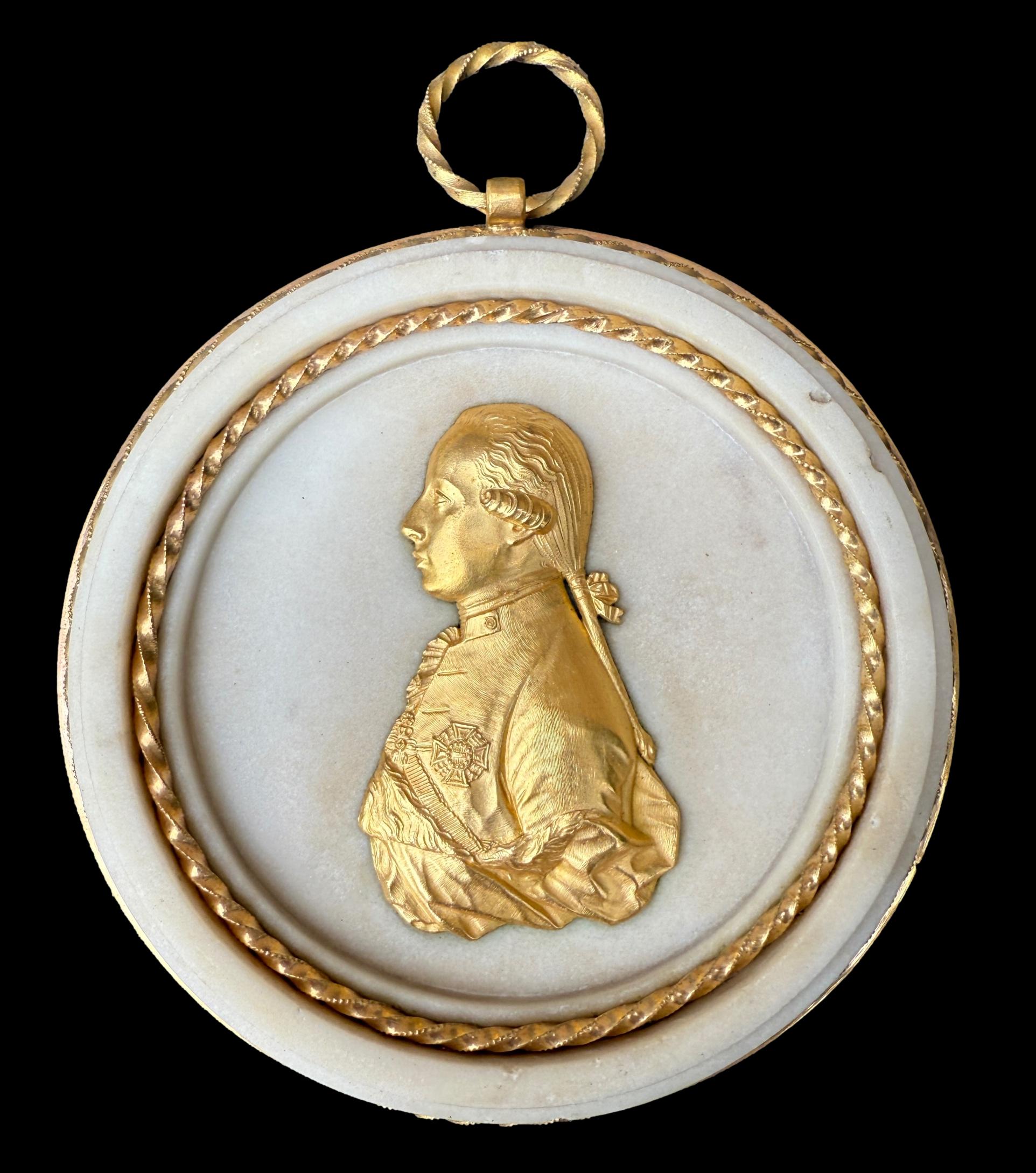 Pair of Louis XVI gilt bronze and marble portrait medallions, depicting Franz I and Maria Theresa, circa 1792