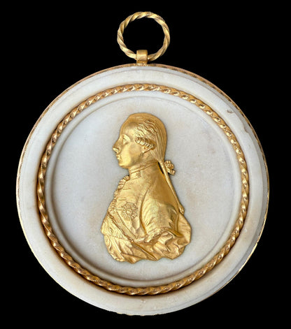 Pair of Louis XVI gilt bronze and marble portrait medallions, depicting Franz I and Maria Theresa, circa 1792