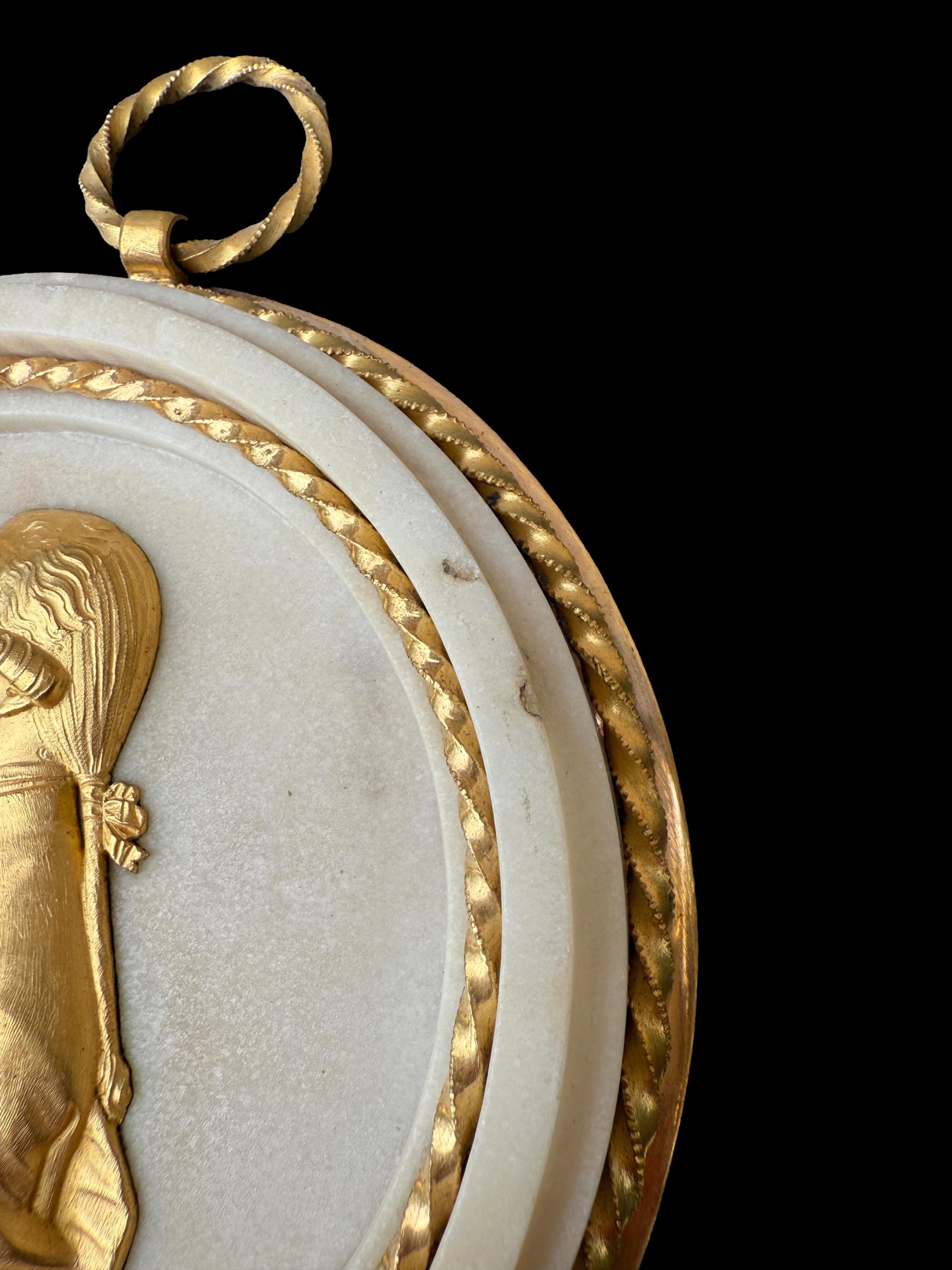 Pair of Louis XVI gilt bronze and marble portrait medallions, depicting Franz I and Maria Theresa, circa 1792