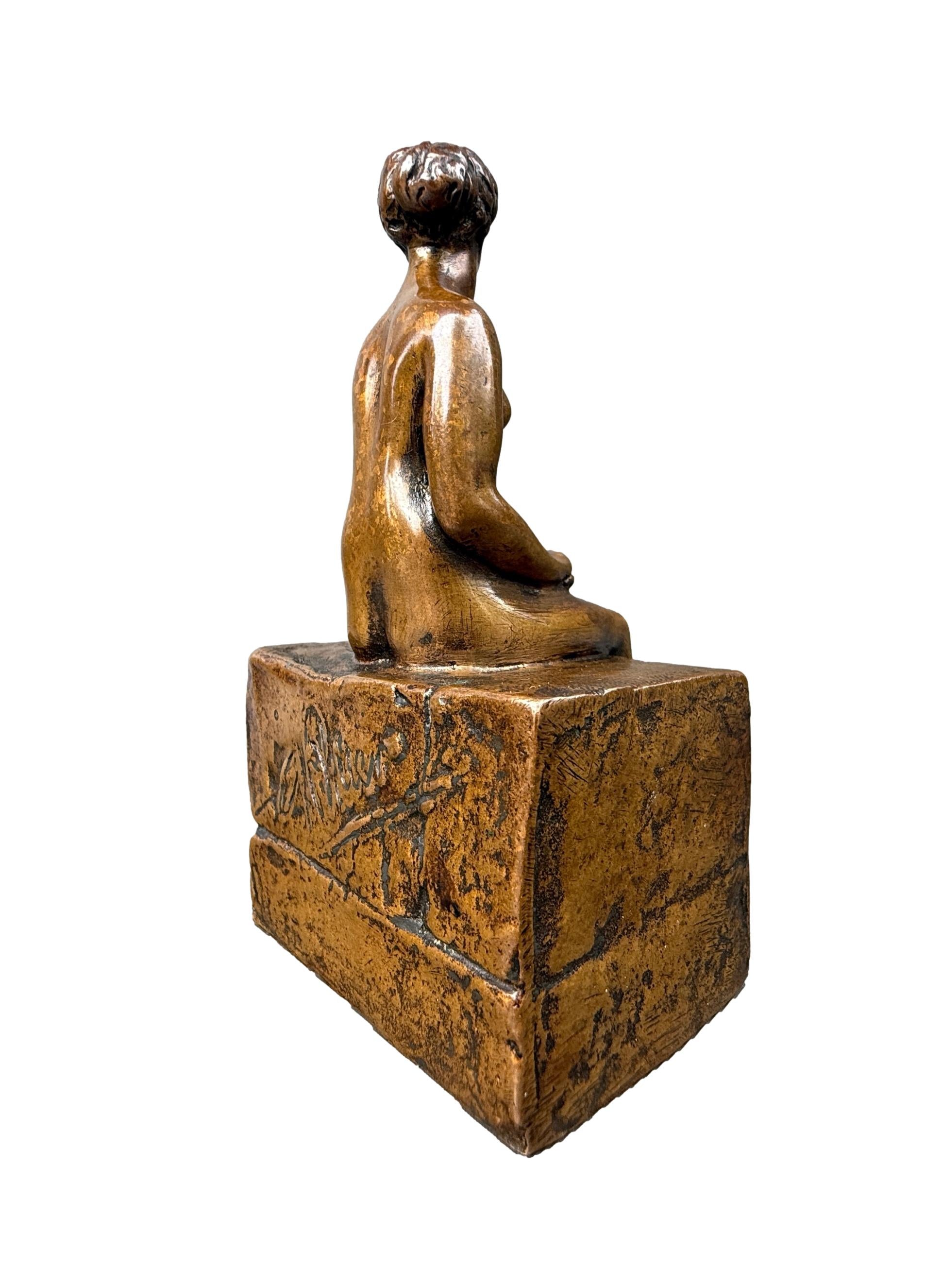 Bronze sculpture of a seated nude woman by Ary Bitter, Art Deco style with warm medal patina, signed on the back