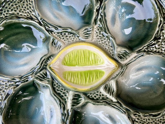 Vintage French Majolica oyster plate by Saint Clément, circa 1930, with six green-blue shell wells and a central lemon design, glazed ceramic faience, Art Deco coastal decor.