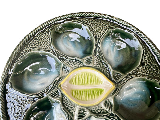 Vintage French Majolica oyster plate by Saint Clément, circa 1930, with six green-blue shell wells and a central lemon design, glazed ceramic faience, Art Deco coastal decor.