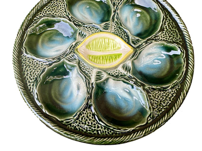 Vintage French Majolica oyster plate by Saint Clément, circa 1930, with six green-blue shell wells and a central lemon design, glazed ceramic faience, Art Deco coastal decor.