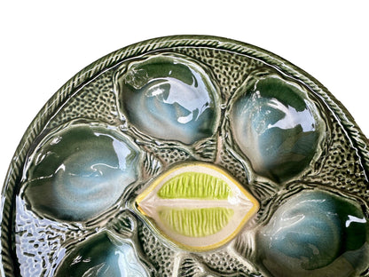 Vintage French Majolica oyster plate by Saint Clément, circa 1930, with six green-blue shell wells and a central lemon design, glazed ceramic faience, Art Deco coastal decor.