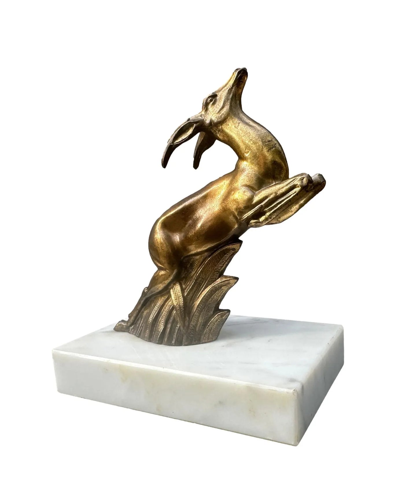 1930s French Art Deco bookends featuring elegant antelope figures on a white marble base. A beautiful vintage design that combines functionality with timeless style.