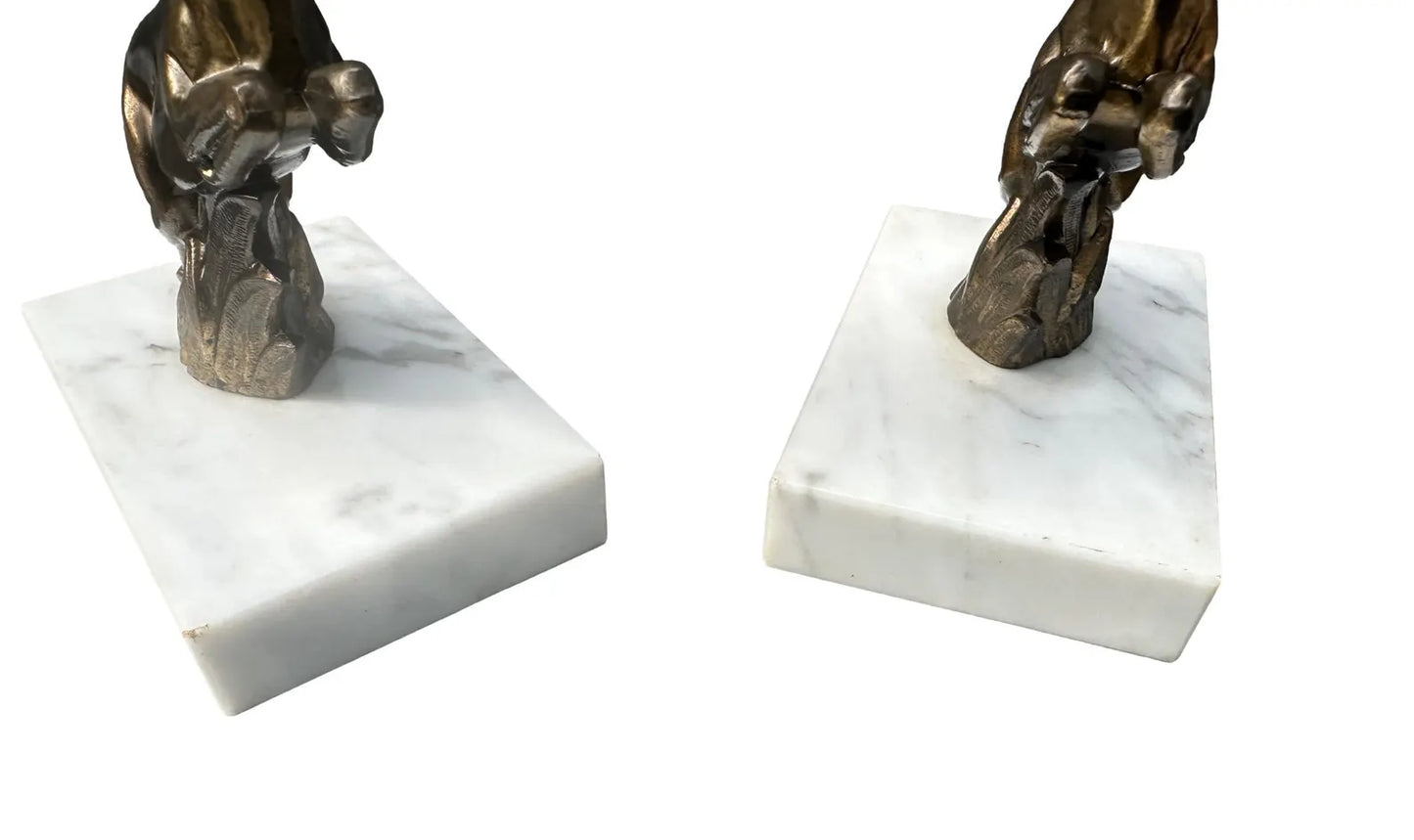 1930s French Art Deco bookends featuring elegant antelope figures on a white marble base. A beautiful vintage design that combines functionality with timeless style.