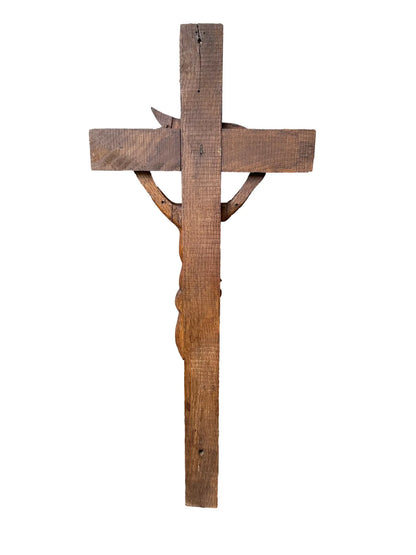 Close-up of a large hand-carved wood wall cross featuring a detailed wooden Jesus corpus statue. A stunning piece of folk art perfect for altars or rustic home decor.