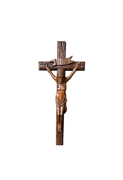 Close-up of a large hand-carved wood wall cross featuring a detailed wooden Jesus corpus statue. A stunning piece of folk art perfect for altars or rustic home decor.