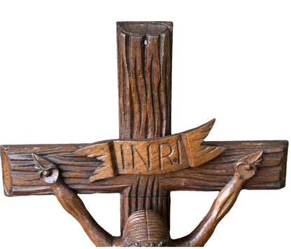 Close-up of a large hand-carved wood wall cross featuring a detailed wooden Jesus corpus statue. A stunning piece of folk art perfect for altars or rustic home decor.