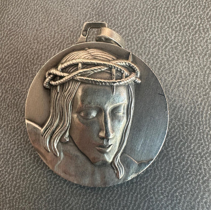 Solid silver medal with high-relief Christ crowned with thorns, Minerva hallmark, Cunfraterna di Santa Croce Bastia inscription.